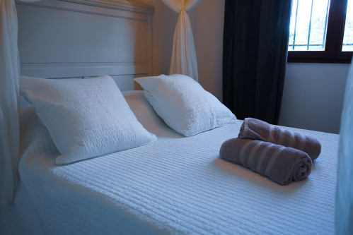 Chambre de l’appartement Premium Piscine